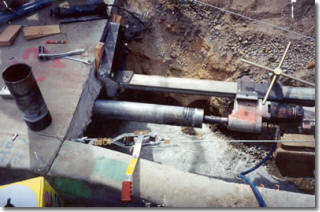 Core drilling through bridge structure